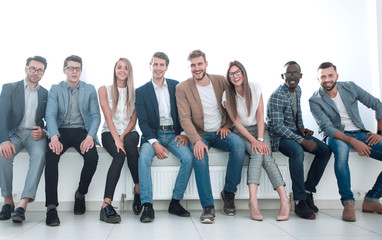 Obraz premium young people are waiting for an interview, sitting in the office lobby