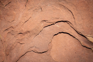 red stone background with rounded layers