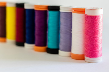 close-up on sewing thread spools