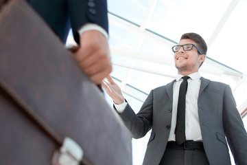 Fototapeta premium Detail of a businessman holding his briefcase