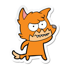 sticker of a cartoon grinning fox