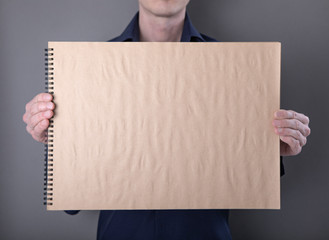 A man holding notebook