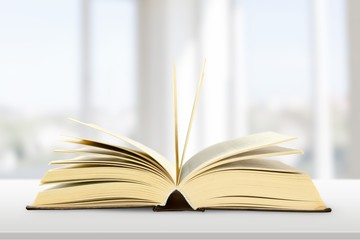 Colorful books collection on background.