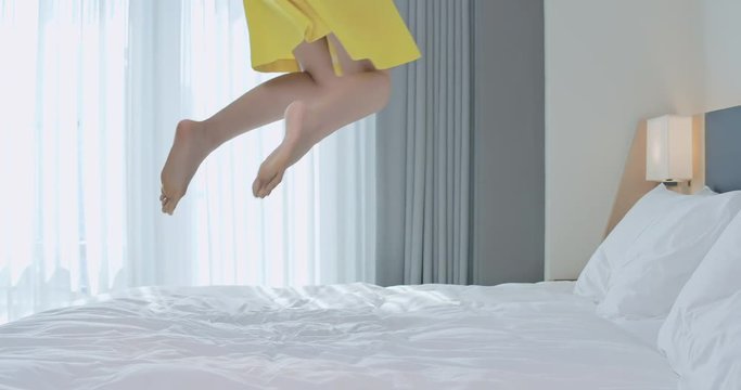 Fashion lady jump on bed