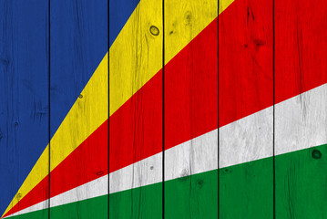 Seychelles flag painted on old wood plank