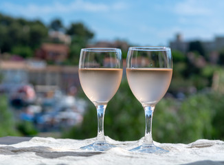 Rose wine of Provence, France, served cold on outdoor terrace in two wine glasses
