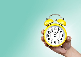 Retro alarm clock on table  background