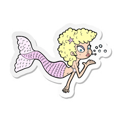 sticker of a cartoon mermaid blowing kiss