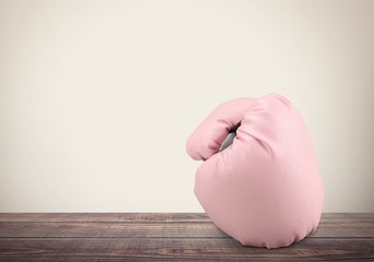 Pink boxing gloves on background