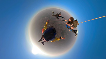 Fototapeta na wymiar Skydiving tandem small planet