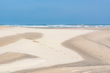 Sand dunes on South Padre Island lead the eye to the blue sky and Gulf of Mexico.