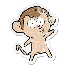 distressed sticker of a cartoon surprised monkey