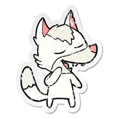 distressed sticker of a cartoon wolf laughing