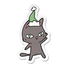 sticker cartoon of a cat staring wearing santa hat