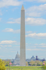 Washington Monument under blue skies with many clouds