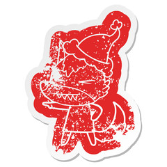 angry wolf cartoon distressed sticker of a wearing santa hat