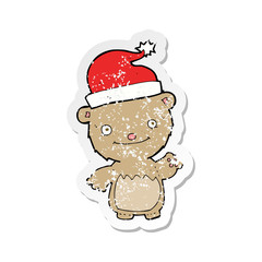 retro distressed sticker of a cartoon christmas teddy bear