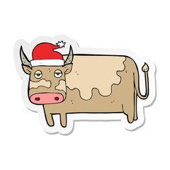 sticker of a cartoon cow with christmas hat