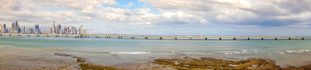 Obraz premium Wide Panoramic Landscape View of Panama City Skyline and Coastal Beltway (Cinta Costera) Marine Viaduct Bay Roadway Bridge