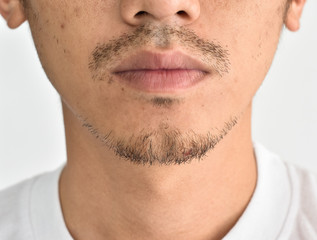 Obraz premium Close up man's face with a mustache
