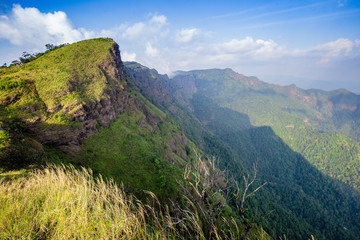 Fototapeta premium Rrainforest mountain viewpoint of Sanknokwua (San Knok Wua) hill at Khao Laem National Park. The highest peak in Kanchanaburi photo during sunrise.