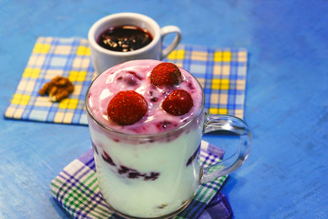 milk yogurt with berry jam.  frozen cherries.