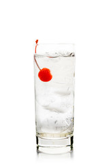 Bitter transparent cocktail with cocktail cherry isolated on white background. Selective focus. Shallow depth of field.