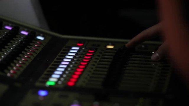 remote recordists closeup. Hand adjusts sound effects. Electric machine on table for working of sound designer or club dj at party in nightclub. Occupation for modern lifestyle, objects for listen at 