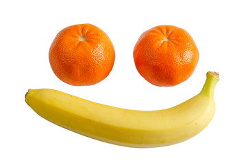 banana and tangerine on a white plate isolate