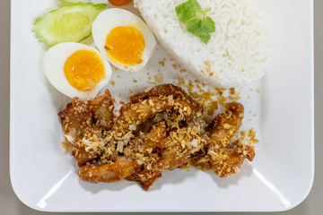 Fried Chicken with Garlic Pepper and boiled egg on Rice