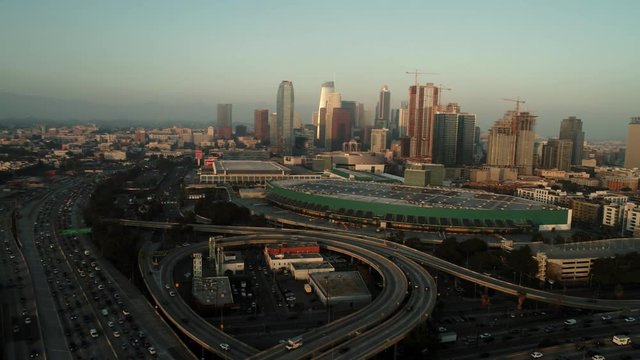 Aerial shot of downtown above the highway in sunset