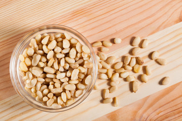  Photo of mix raw pine nut on the wooden desk