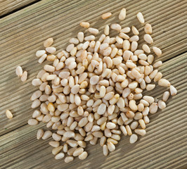 Picture of  wooden desk with raw pine nut, nobody
