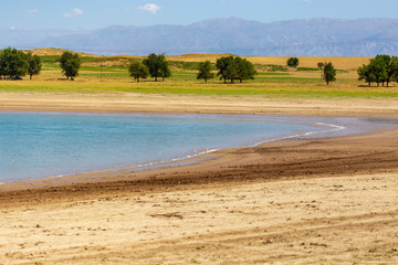 Blue water in the Badam reservoir in the south of Kazakhstan