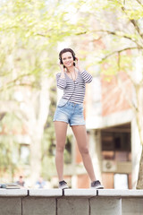 Young student standing in front of a camera outdoors