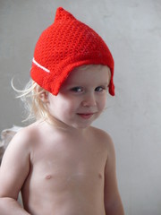 baby in knitted red hat - Santa's childhood