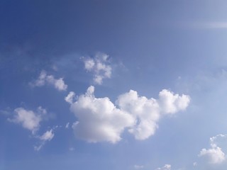 blue sky with white fluffy clouds