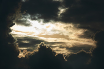 heaven light in dramatic sky with dark cloud