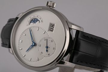 Men's watch with black leather strap,white dial,blue clockwise,chronograph and stopwatch isolated...