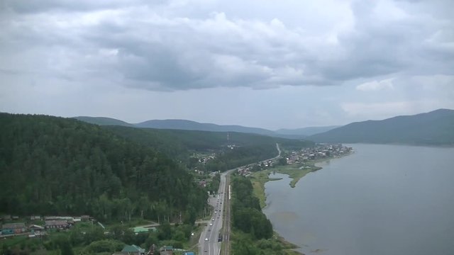 Scenic view of the big river, road, home
