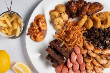 Assortment of snacks for beer, shrimps and fried cheese