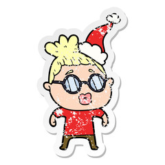 distressed sticker cartoon of a woman wearing spectacles wearing santa hat