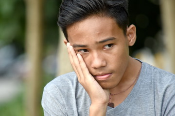 An Unhappy Teen Boy