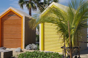 Colored beach huts, wooden cabins. Changing rooms for rent.  Beach Vacation background.