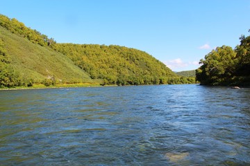 Fototapeta premium Beautiful Bystraya Malkinskaya river flows in valley between hills on the Kamchatka Peninsula, Russia.