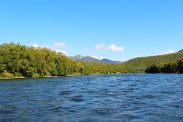 Beautiful Bystraya Malkinskaya river flows in valley between hills on the Kamchatka Peninsula, Russia.