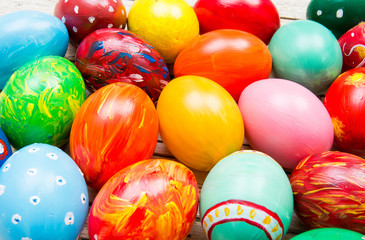 Fototapeta na wymiar Easter background with handmade colored eggs. Festive tradition