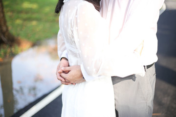 Wedding couple holding hands on sunset With Wedding Ring.