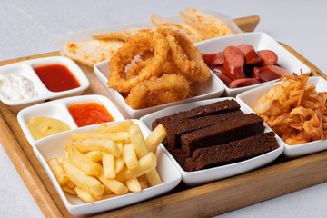chicken and beef, bread, sausages and sauce for lunch