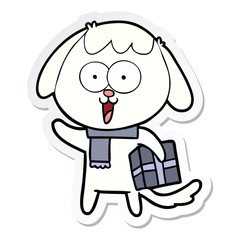 sticker of a cute cartoon dog with christmas present